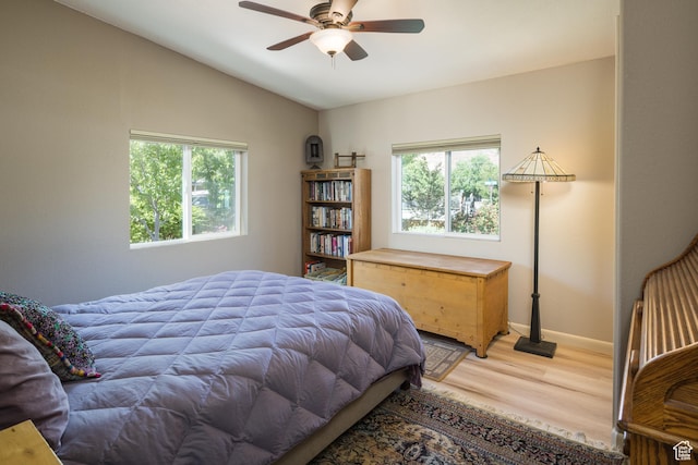 460 E Bowen Cir, Moab, UT 84532 - bedroom featuring multiple windows, light wood-style flooring, vaulted ceiling, and ceiling fan
