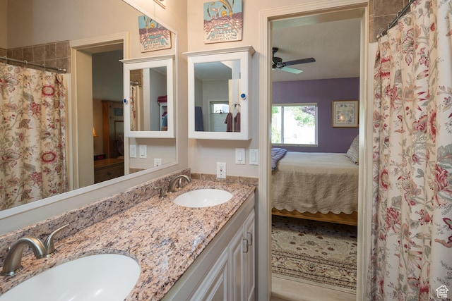 460 E Bowen Cir, Moab, UT 84532 - ensuite bathroom with double vanity, a ceiling fan, and a shower with curtain