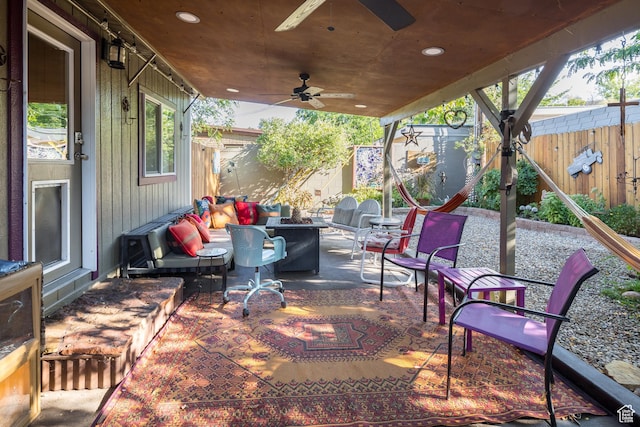 460 E Bowen Cir, Moab, UT 84532 - fenced backyard with outdoor lounge area, a patio area, and a ceiling fan