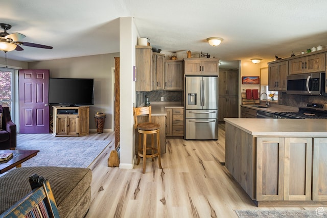 460 E Bowen Cir, Moab, UT 84532 - kitchen with stainless steel appliances, ceiling fan, light countertops, and light wood finished floors