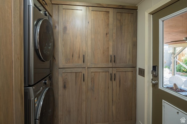 460 E Bowen Cir, Moab, UT 84532 - washroom featuring stacked washer / drying machine and cabinet space