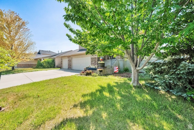 1047 W Ascot Dr N, North Salt Lake, UT 84054 - view of property hidden behind natural elements with driveway, stone siding, a front yard, and a garage