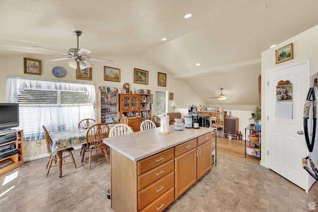 1047 W Ascot Dr N, North Salt Lake, UT 84054 - kitchen featuring ceiling fan, vaulted ceiling, light countertops, a kitchen island, and recessed lighting