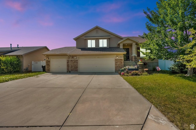 1047 W Ascot Dr N, North Salt Lake, UT 84054 - view of front of house with concrete driveway, brick siding, and an attached garage