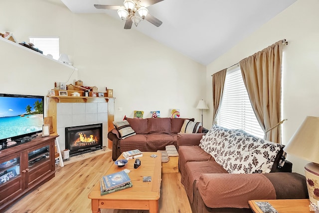 1047 W Ascot Dr N, North Salt Lake, UT 84054 - living area featuring a ceiling fan, light wood finished floors, vaulted ceiling, and a fireplace