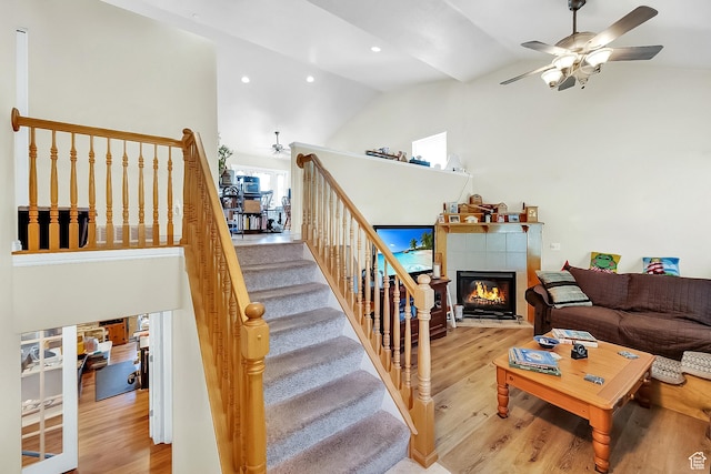 1047 W Ascot Dr N, North Salt Lake, UT 84054 - living area featuring ceiling fan, high vaulted ceiling, wood finished floors, a tiled fireplace, and recessed lighting