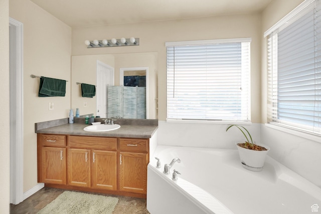 1047 W Ascot Dr N, North Salt Lake, UT 84054 - bathroom with vanity, a bath, and healthy amount of natural light