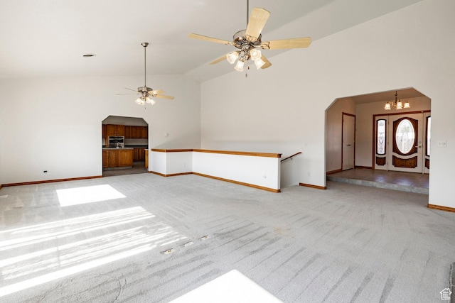 3787 E 1200 S, Heber City, UT 84032 - unfurnished living room featuring arched walkways, light carpet, ceiling fan, and high vaulted ceiling