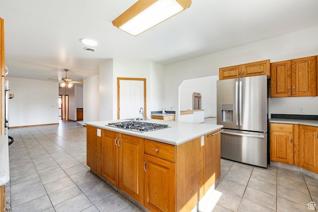 3787 E 1200 S, Heber City, UT 84032 - kitchen featuring stainless steel appliances, light tile patterned flooring, a ceiling fan, and light countertops