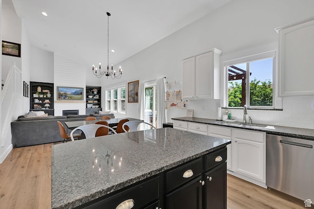 874 W Steeple Chase Dr, Kaysville, UT 84037 - kitchen featuring stainless steel dishwasher, white cabinetry, light wood-type flooring, high vaulted ceiling, and dark cabinets