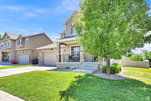 874 W Steeple Chase Dr, Kaysville, UT 84037 - view of front of home with stucco siding, driveway, a porch, stone siding, and a garage
