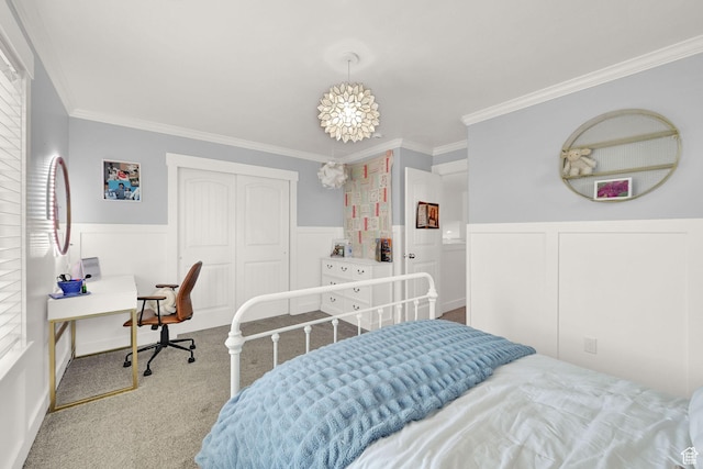 874 W Steeple Chase Dr, Kaysville, UT 84037 - carpeted bedroom featuring a wainscoted wall, ornamental molding, a closet, and a decorative wall