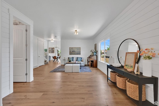 874 W Steeple Chase Dr, Kaysville, UT 84037 - living area with a chandelier and light wood-type flooring