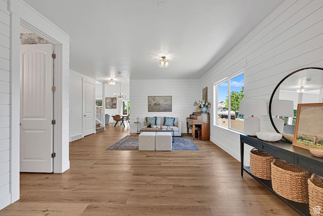 874 W Steeple Chase Dr, Kaysville, UT 84037 - living area with wood finished floors, a chandelier, and wooden walls