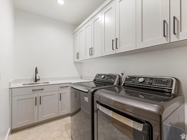 1783 E Bermondsey Ct, Holladay, UT 84117 - laundry area with washer and clothes dryer, cabinet space, light tile patterned floors, and recessed lighting