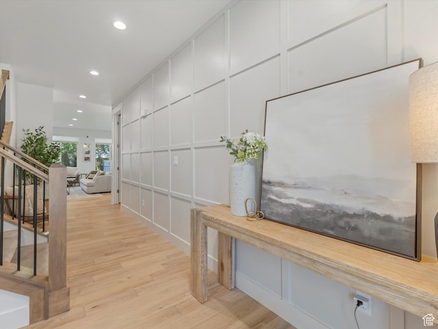 1783 E Bermondsey Ct, Holladay, UT 84117 - hall featuring light wood-style floors, a decorative wall, stairs, and recessed lighting