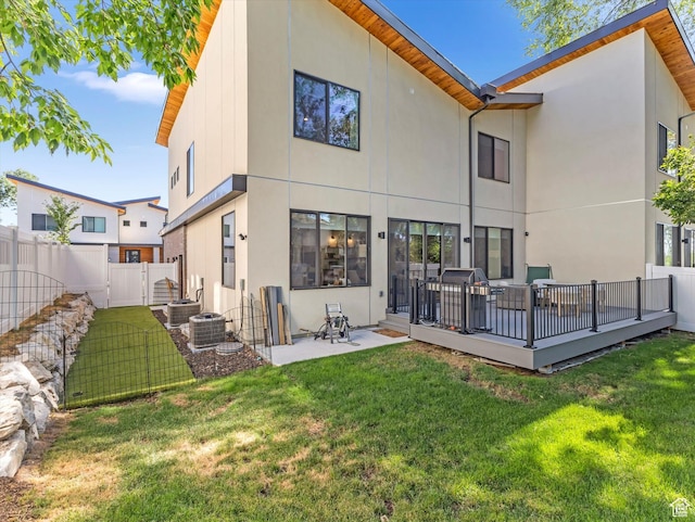 1783 E Bermondsey Ct, Holladay, UT 84117 - rear view of house with stucco siding and a wooden deck