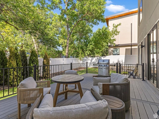 1783 E Bermondsey Ct, Holladay, UT 84117 - wooden terrace featuring a grill, an outdoor hangout area, and a fenced backyard