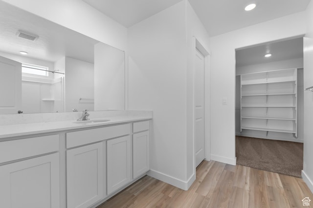 837 N 1860 E Unit 158, Salem, UT 84653 - full bathroom with vanity, a walk in closet, wood finished floors, and recessed lighting