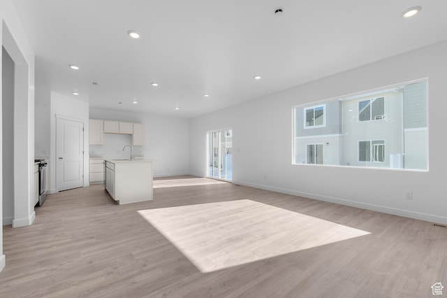 837 N 1860 E Unit 158, Salem, UT 84653 - unfurnished living room featuring light wood finished floors and recessed lighting