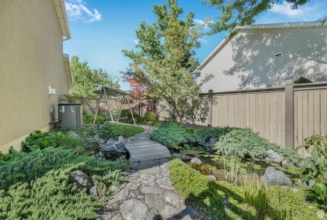 823 Creek Ln, Farmington, UT 84025 - fenced backyard featuring a small pond