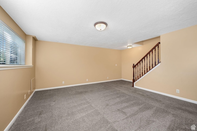 823 Creek Ln, Farmington, UT 84025 - unfurnished living room featuring stairs, carpet floors, and a textured ceiling