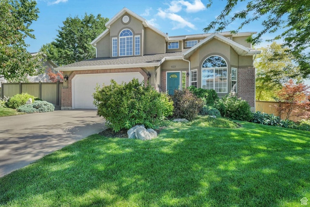 823 Creek Ln, Farmington, UT 84025 - traditional-style home with stucco siding, concrete driveway, brick siding, and a garage