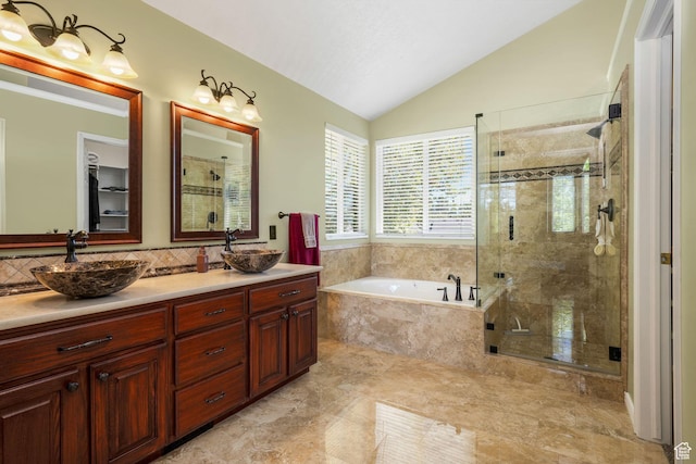 823 Creek Ln, Farmington, UT 84025 - bathroom featuring a bath, vaulted ceiling, a shower stall, double vanity, and decorative backsplash