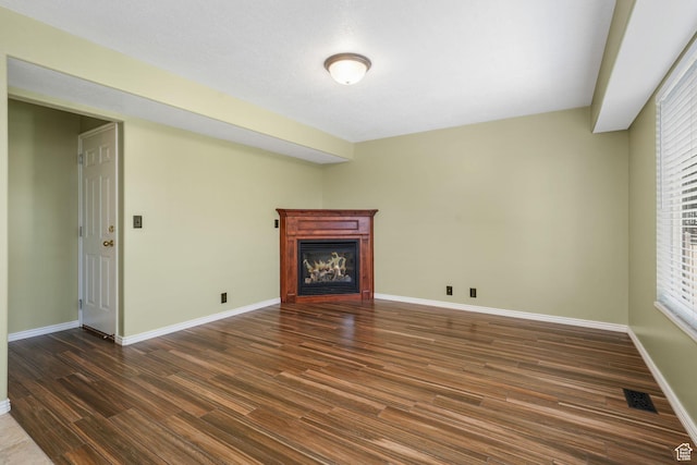 823 Creek Ln, Farmington, UT 84025 - unfurnished living room with dark wood finished floors and a glass covered fireplace