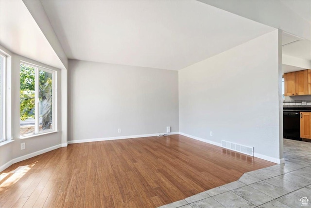 3221 W 6920 S, West Jordan, UT 84084 - unfurnished living room featuring light wood finished floors and baseboards