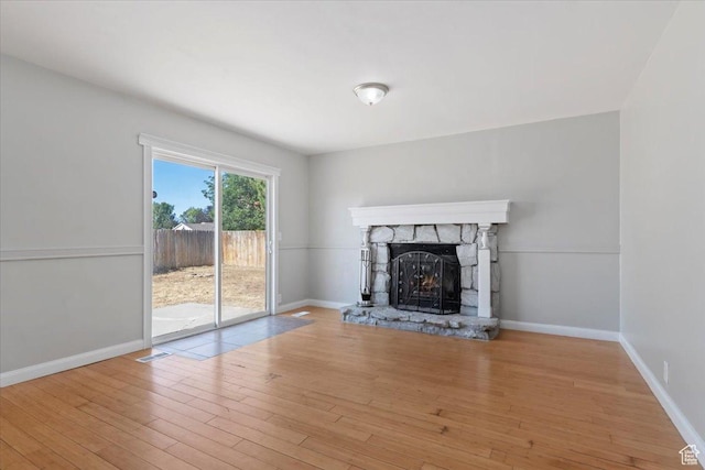3221 W 6920 S, West Jordan, UT 84084 - unfurnished living room with a fireplace and wood finished floors