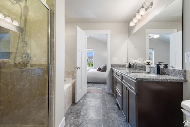 7873 S Farm House Ln E, Midvale, UT 84047 - full bath featuring double vanity, a ceiling fan, a shower stall, a garden tub, and connected bathroom