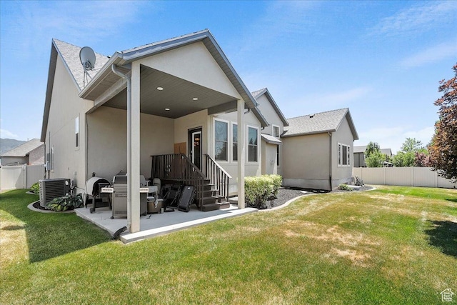 3695 S 3525 W, West Haven, UT 84401 - back of property featuring stucco siding, a fenced backyard, and a patio area