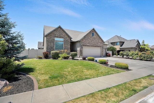 3695 S 3525 W, West Haven, UT 84401 - view of front of property with stone siding, driveway, and an attached garage