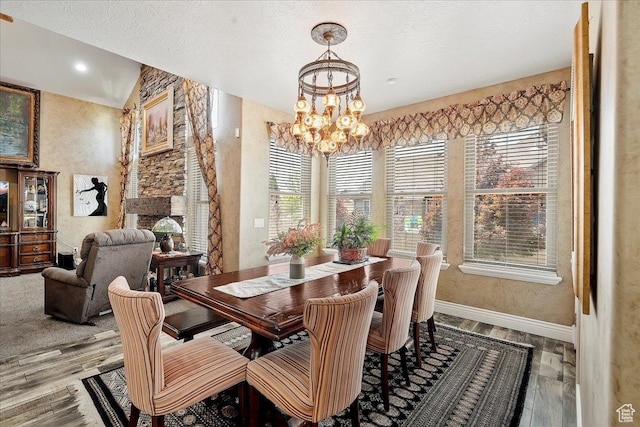 3695 S 3525 W, West Haven, UT 84401 - dining room with a chandelier, wood finished floors, a textured wall, and a textured ceiling
