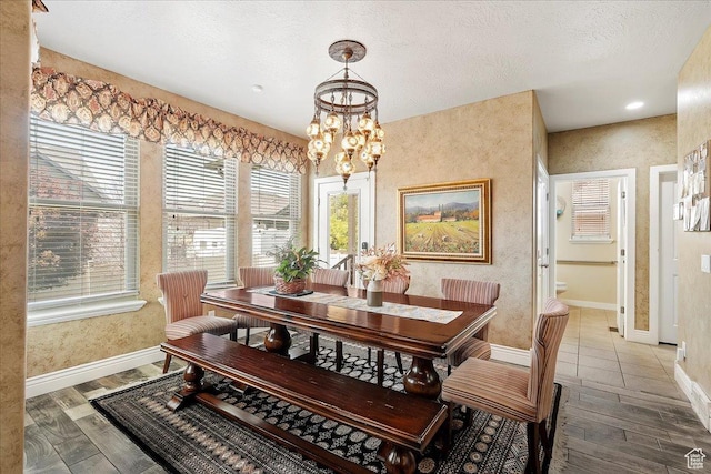 3695 S 3525 W, West Haven, UT 84401 - dining space featuring a chandelier, plenty of natural light, and wood finished floors