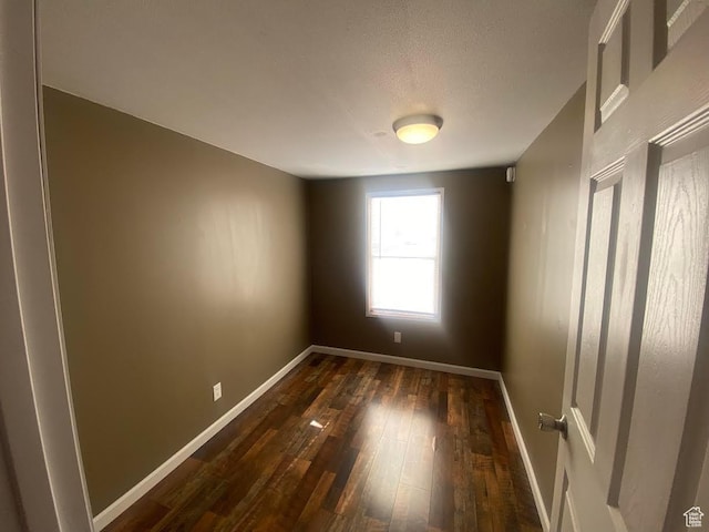 313 E 800 N, Duchesne, UT 84021 - empty room featuring dark wood-style flooring and a textured ceiling