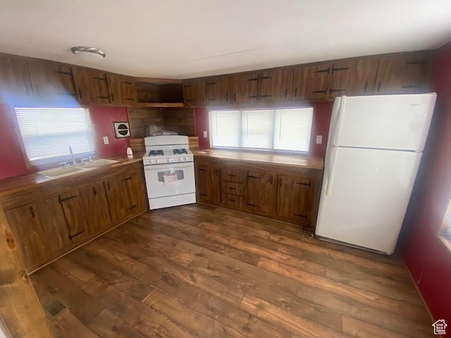 313 E 800 N, Duchesne, UT 84021 - kitchen featuring white appliances, dark wood-style flooring, and brown cabinetry