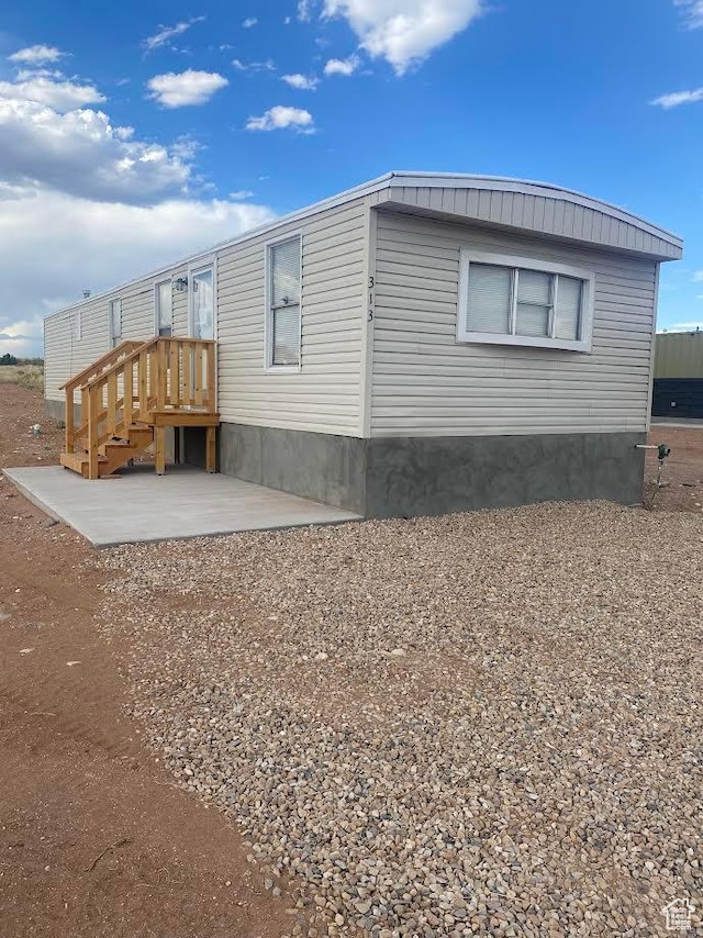 313 E 800 N, Duchesne, UT 84021 - view of side of home featuring a patio area