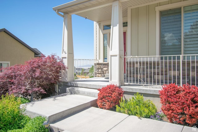 1233 E Upland Dr S Unit 112, Tooele, UT 84074 - doorway to property featuring a porch and board and batten siding