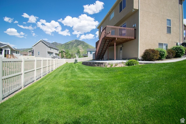 1233 E Upland Dr S Unit 112, Tooele, UT 84074 - fenced backyard with stairs and a deck with mountain view
