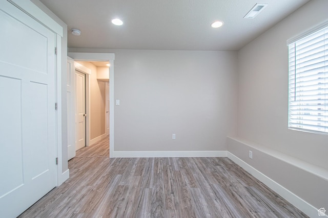 1233 E Upland Dr S Unit 112, Tooele, UT 84074 - unfurnished room with light wood-type flooring, a smoke detector, and recessed lighting