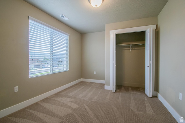 1233 E Upland Dr S Unit 112, Tooele, UT 84074 - unfurnished bedroom featuring carpet floors and a closet