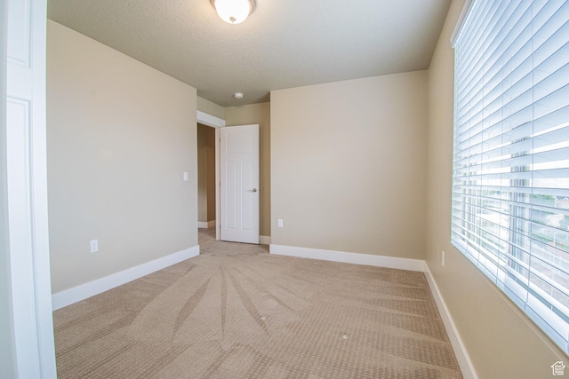 1233 E Upland Dr S Unit 112, Tooele, UT 84074 - spare room with light colored carpet and baseboards