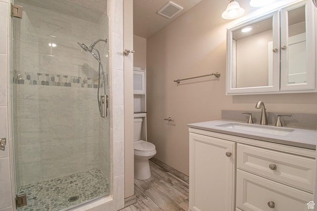 1233 E Upland Dr S Unit 112, Tooele, UT 84074 - bathroom with a stall shower, vanity, and wood finished floors