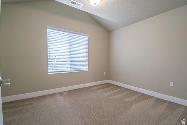 1233 E Upland Dr S Unit 112, Tooele, UT 84074 - spare room featuring lofted ceiling and light carpet