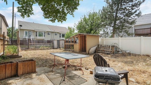 1248 E Freshman Cir, Millcreek, UT 84117 - fenced backyard featuring a storage unit and a patio area