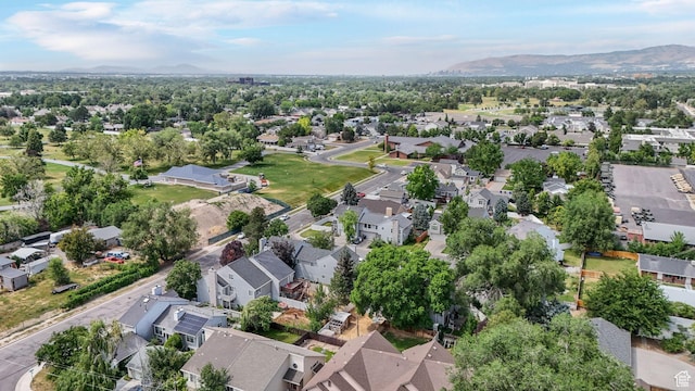 1248 E Freshman Cir, Millcreek, UT 84117 - aerial view of property and surrounding area featuring nearby suburban area and a mountain backdrop