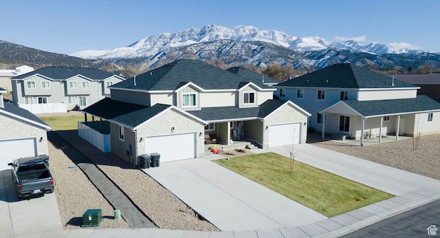 926 N 165 W, Nephi, UT 84648 - view of front of property featuring a mountain view, concrete driveway, a garage, and a front yard