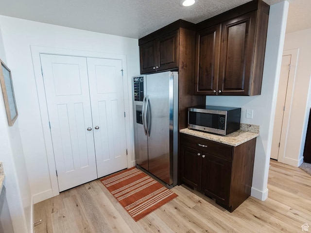 926 N 165 W, Nephi, UT 84648 - kitchen featuring stainless steel appliances, light wood-style floors, dark brown cabinetry, light stone counters, and recessed lighting